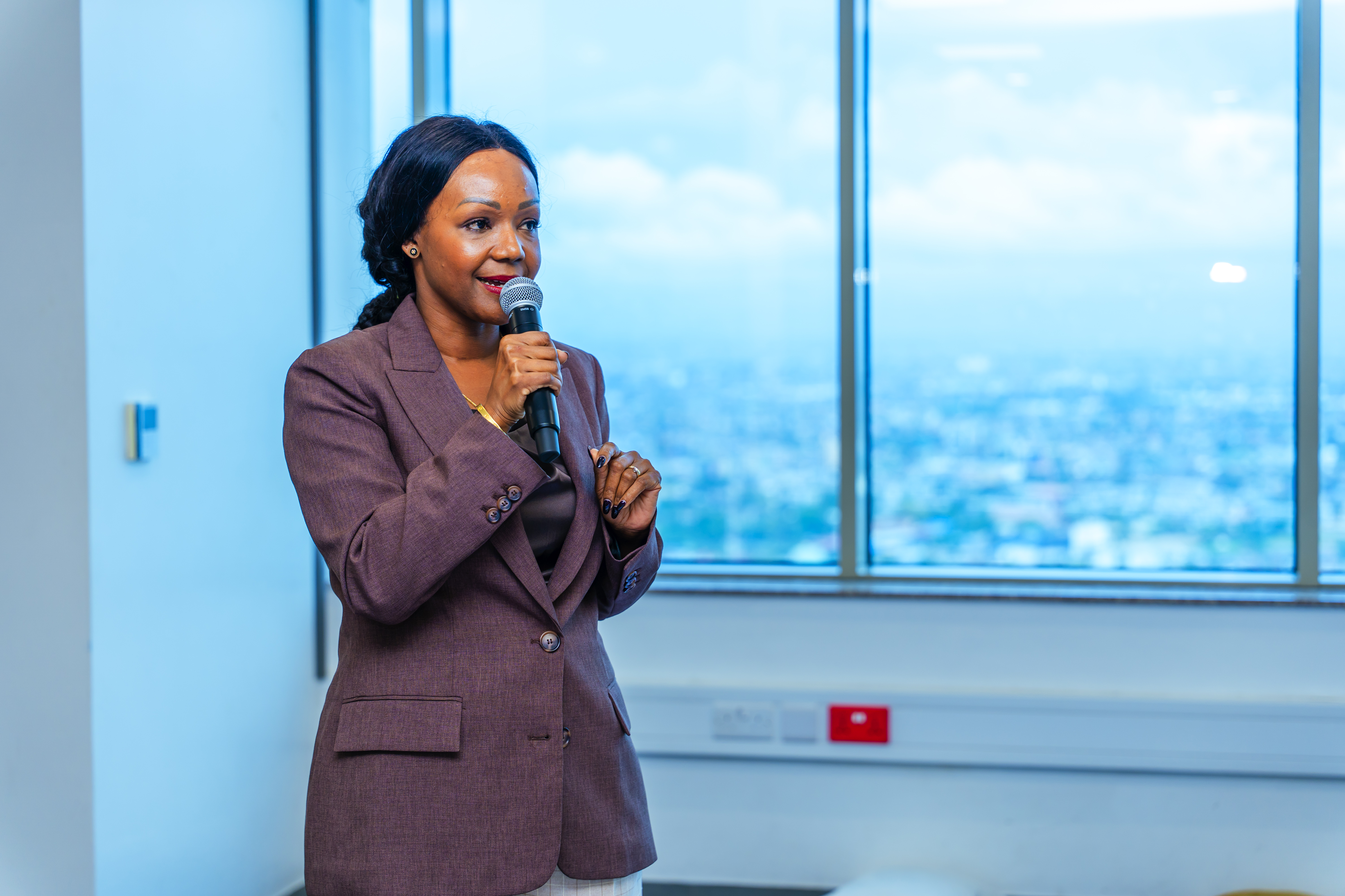 Rosalynn Mndolwa-Mworia delivering a keynote address as a speaker at the International Women's Day 2026 event organized by YAS Tanzania