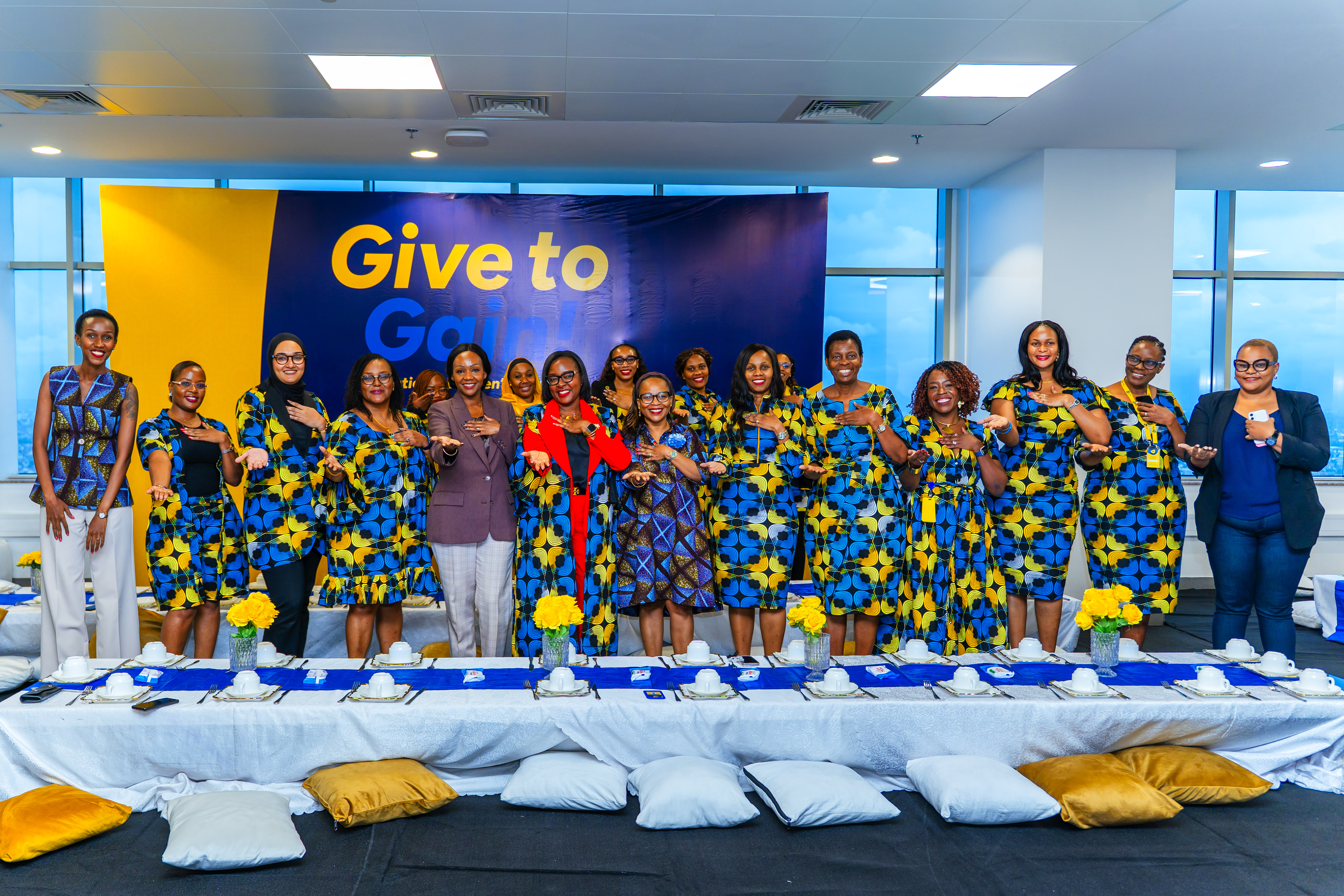 Rosalynn Mndolwa-Mworia posing with YAS Tanzania women employees at the International Women's Day 2026 celebration in Dar es Salaam